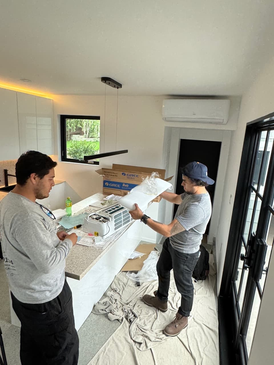 Multi-zone mini-split serving multiple rooms